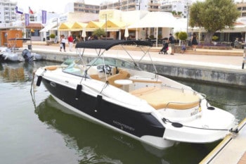 A Monterey 268ss with a large swim deck at dock in the water.