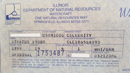 A boat registration card being used to understand the three letter code of the boat's manufacture.