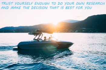 A boat out on the lake at sunset with hills in the background and text that states "Trust yourself enough to do your own research and make the decision that is best for you".