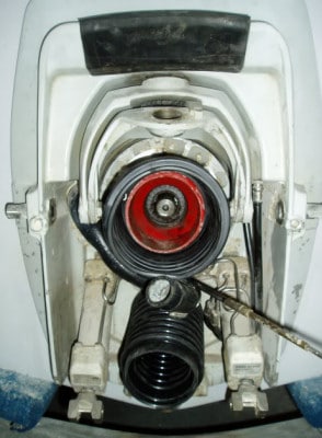 A boat transom with the sterndrive unit removed showing how it mounts and seals out water.
