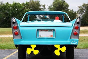 A blue Amphicar with bright yellow popellers sitting in a parking lot.