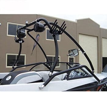 Wakeboard tower installed on boat with building in background