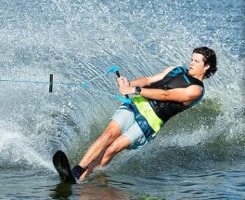 Man water skiing on O'Brien Celebrity 68 Water Skis with X-7 Adjustable Bindings in the water.