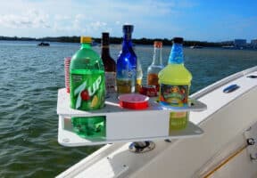 Docktail Boat Bar & Ultimate Marine Cup & Bottle Holder on display mounted to a boat in the water.