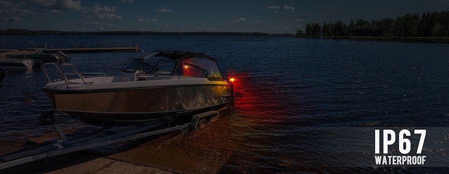 Guide post light kit on a boat trailer in water with boat on it.