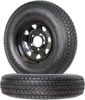 A tire and rim combo with black rims on display with a white background.